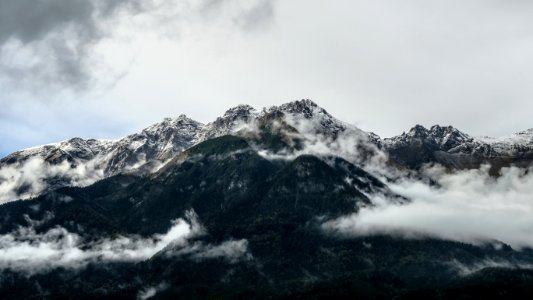 mountain under white cloudy sky photo