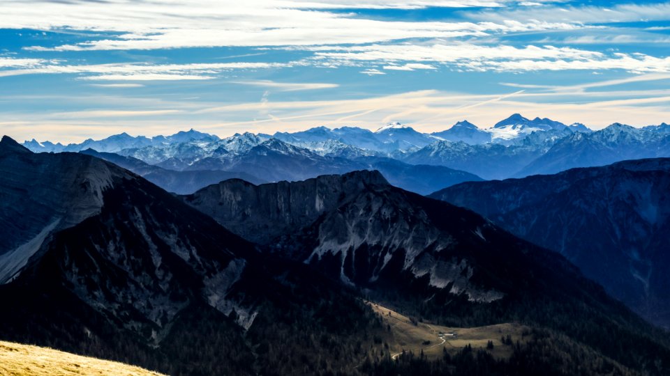 black and white mountains under white clouds and blue sky during daytime photo