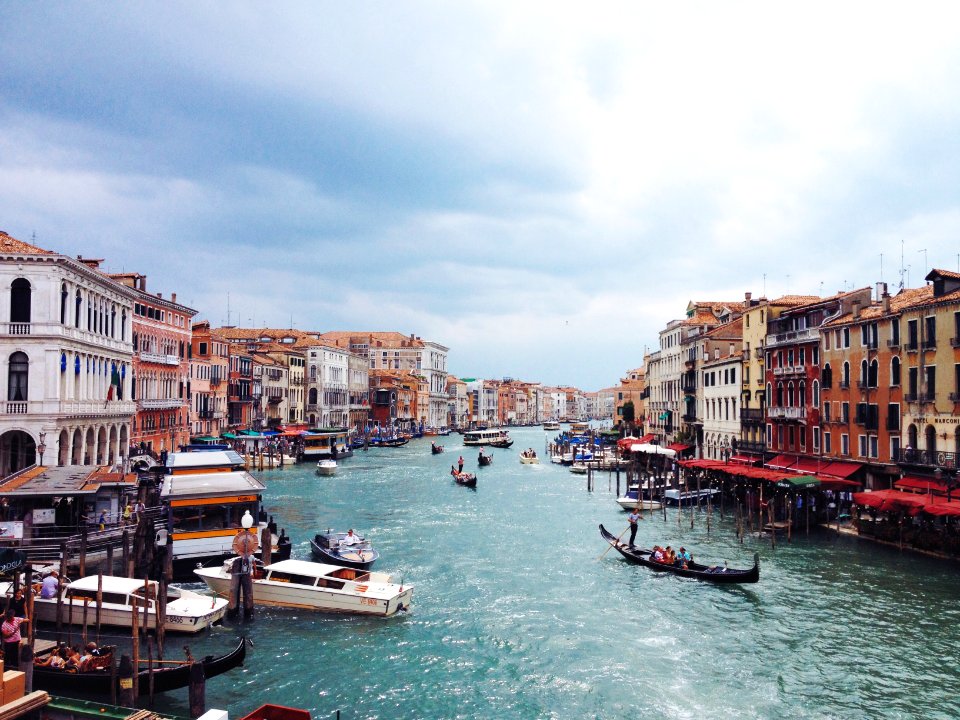 boats on body of water near buildings
