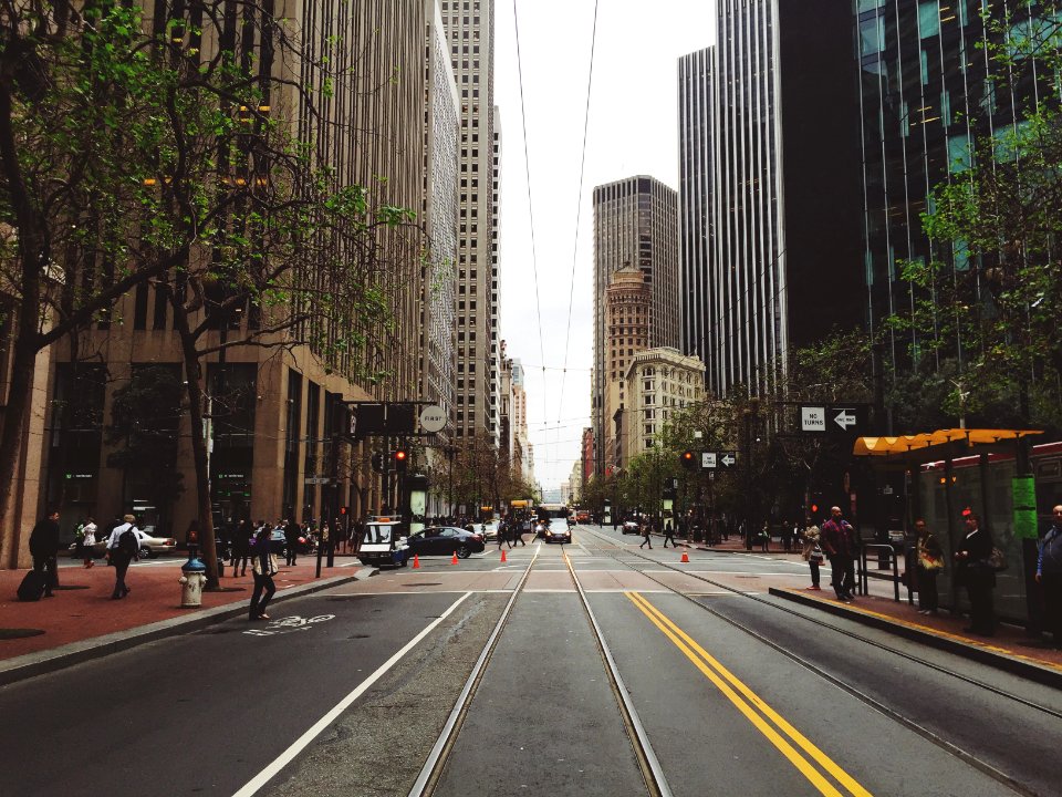 people walking on city sidewalk