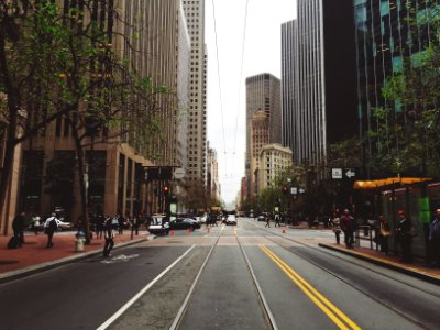 people walking on city sidewalk