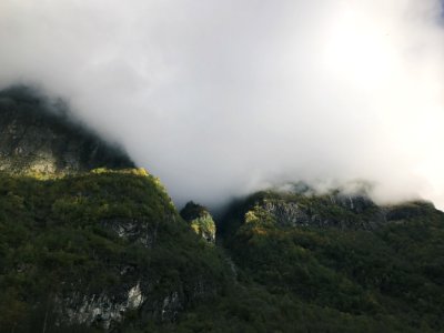 green mountain under cloudy sky