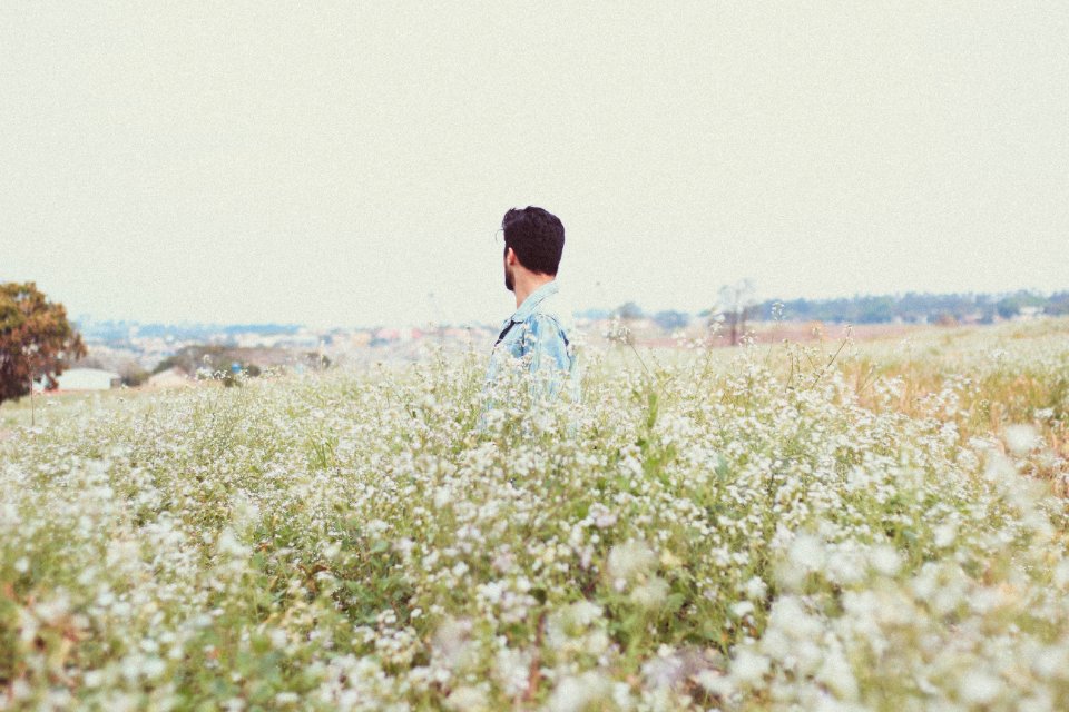man in garden of flowers