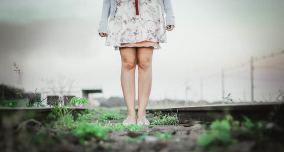 person standing wearing white dress photo