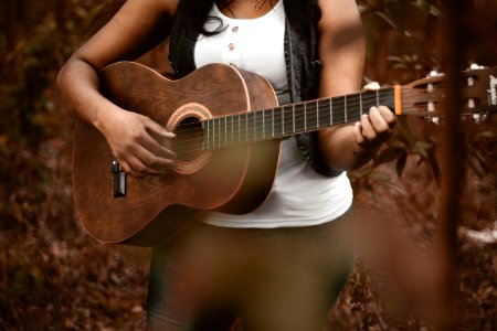 person playing guitar photo