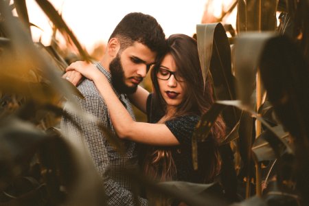 woman hugging man at the corn field photo