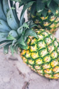 two ripe pineapples in macro photography photo
