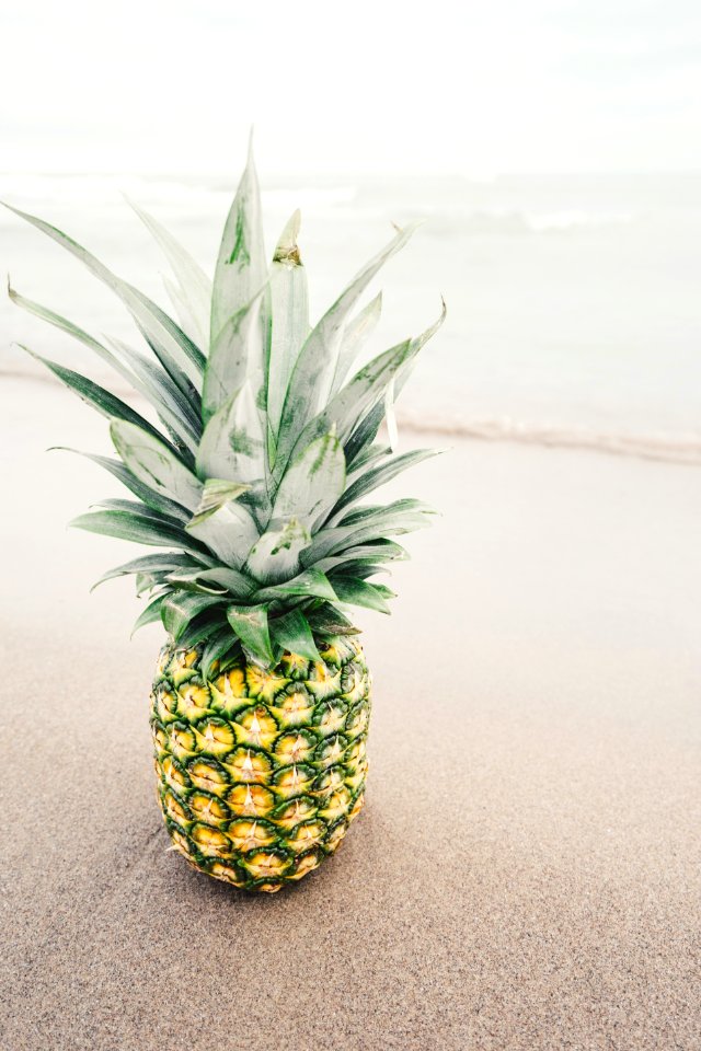 pineapple fruit on gray surface