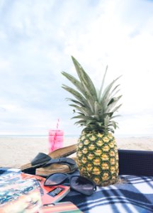 pineapple beside black sunglasses photo