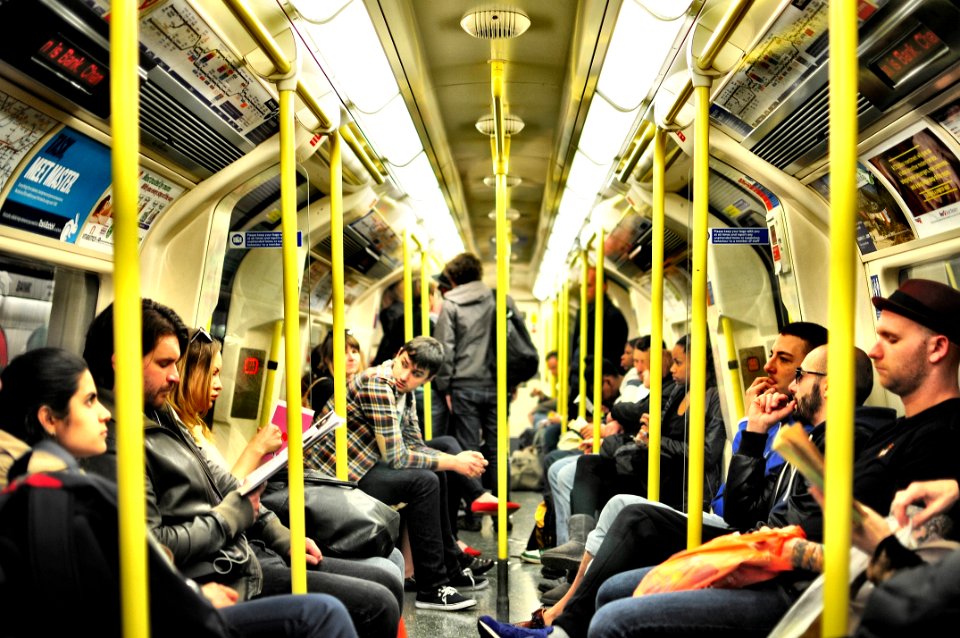 photo of group on people sitting inside train photo