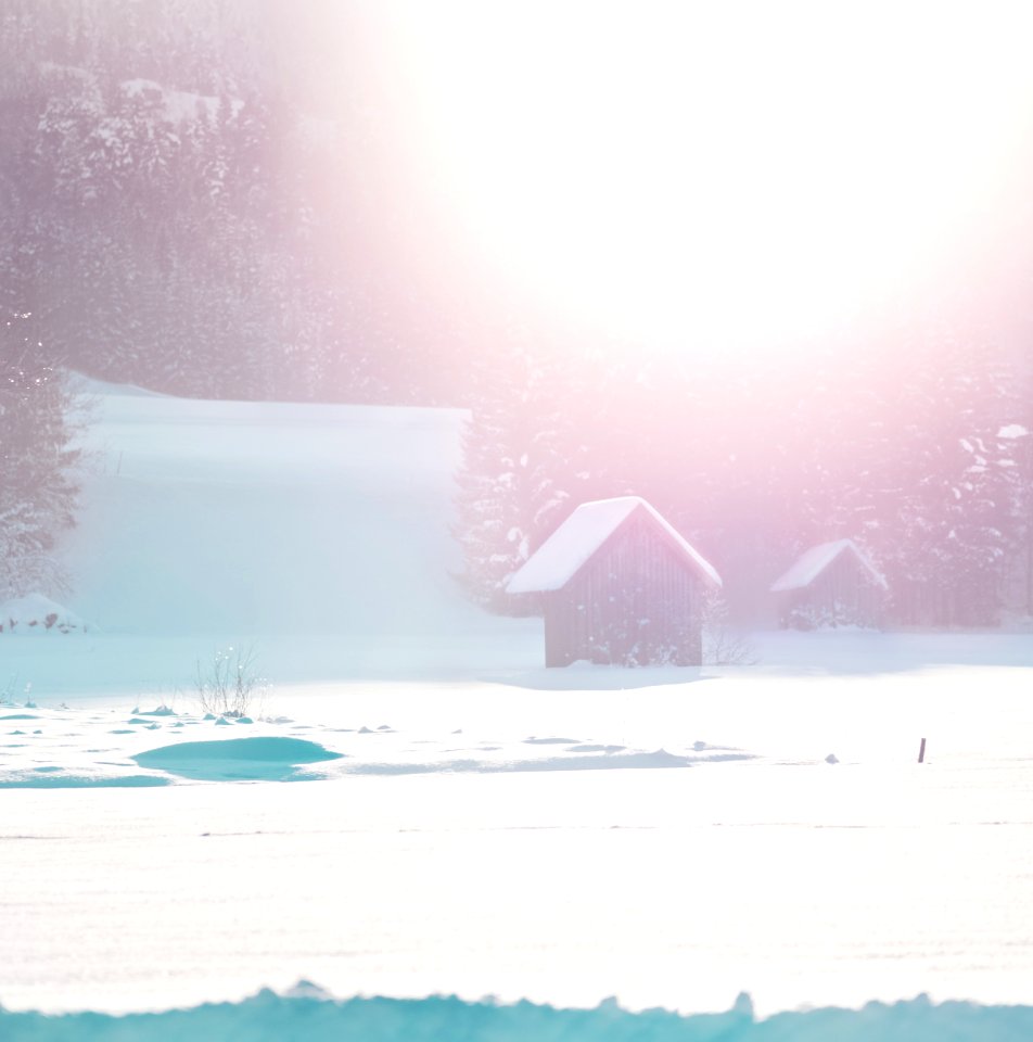 black house on snow field at daytime