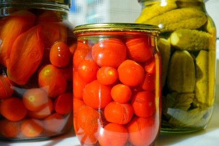 Canned tomatoes canned cucumbers pickled tomatoes photo