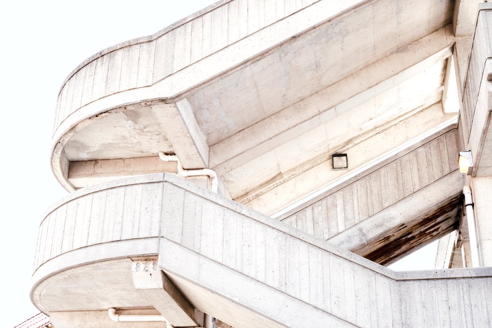 beige concrete stairs with white skies background