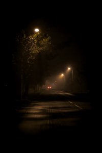 turned-on street lamps