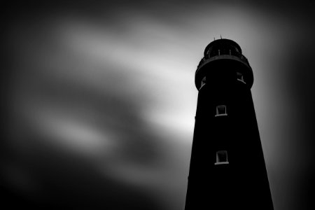low angle photography of black lighthouse photo