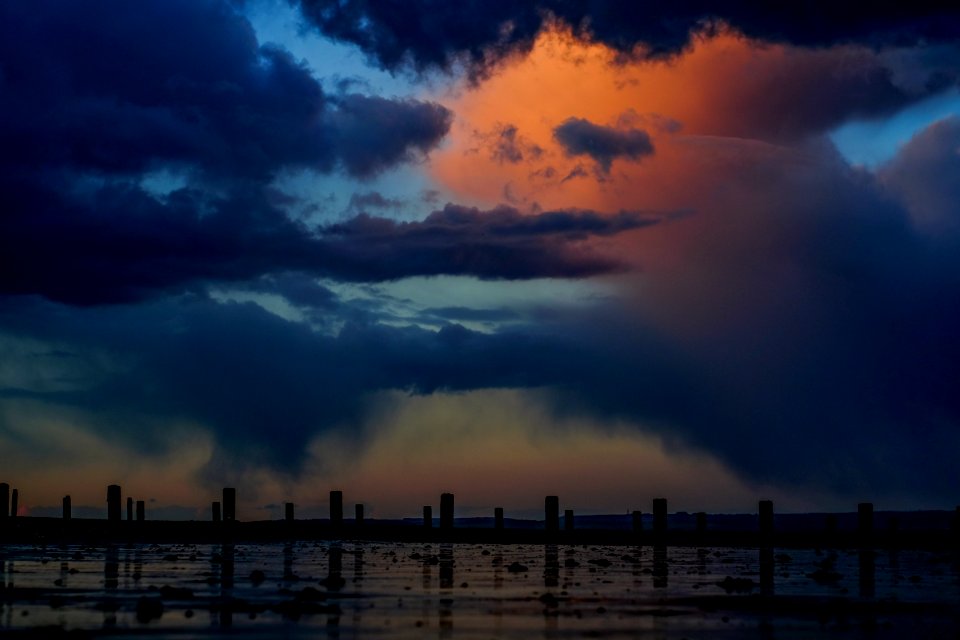 blue sea under cloudy sky