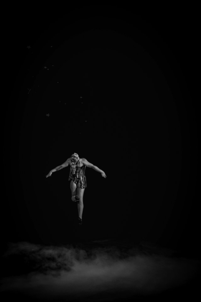flying person over clouds