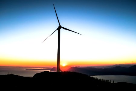 silhouette of wind mill during golden hour photo