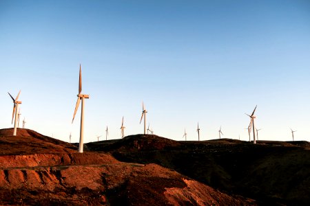 white wind turbines during daytime