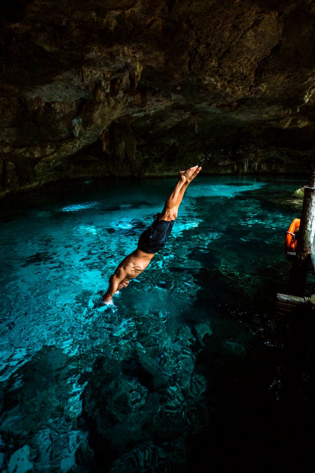 man diving in water