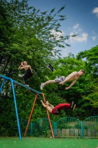 Older boys meditating and jumping off a swing set.