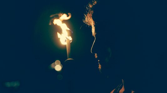 man standing in front of candle photo