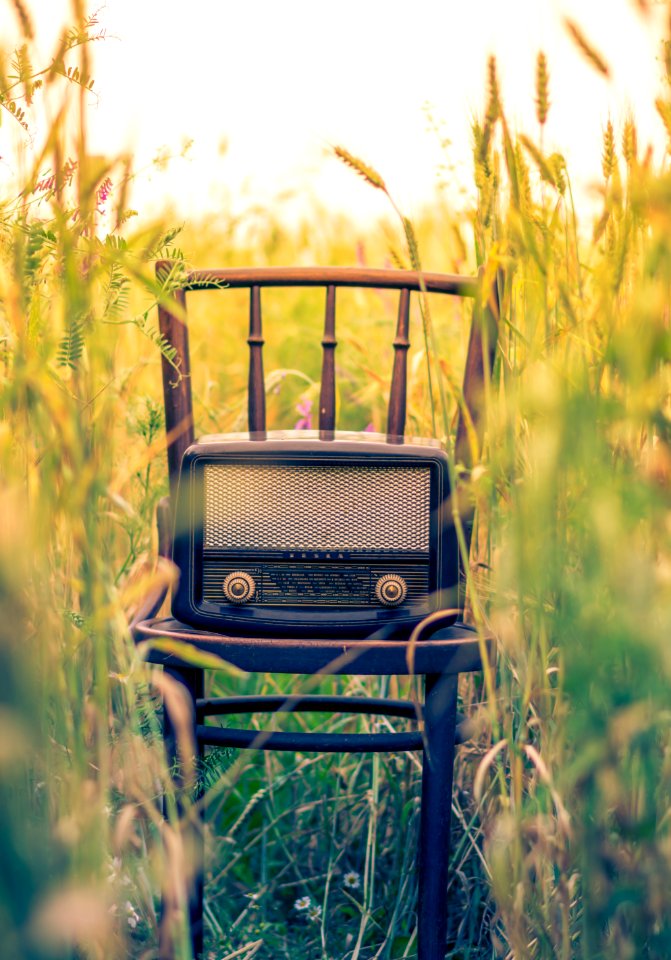 black transistor radio in the middle of the field