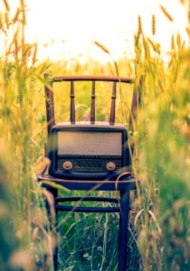 black transistor radio in the middle of the field photo