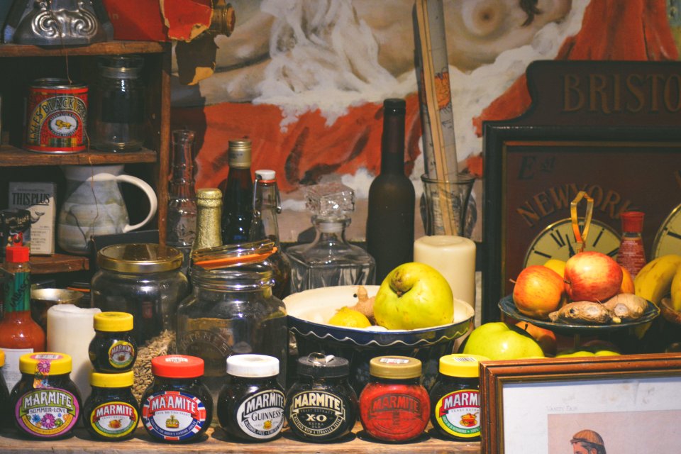 assorted jars and vegetables on table photo