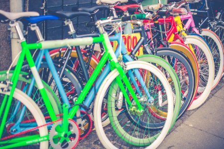 photo of assorted-color bicycles on gray pavement photo