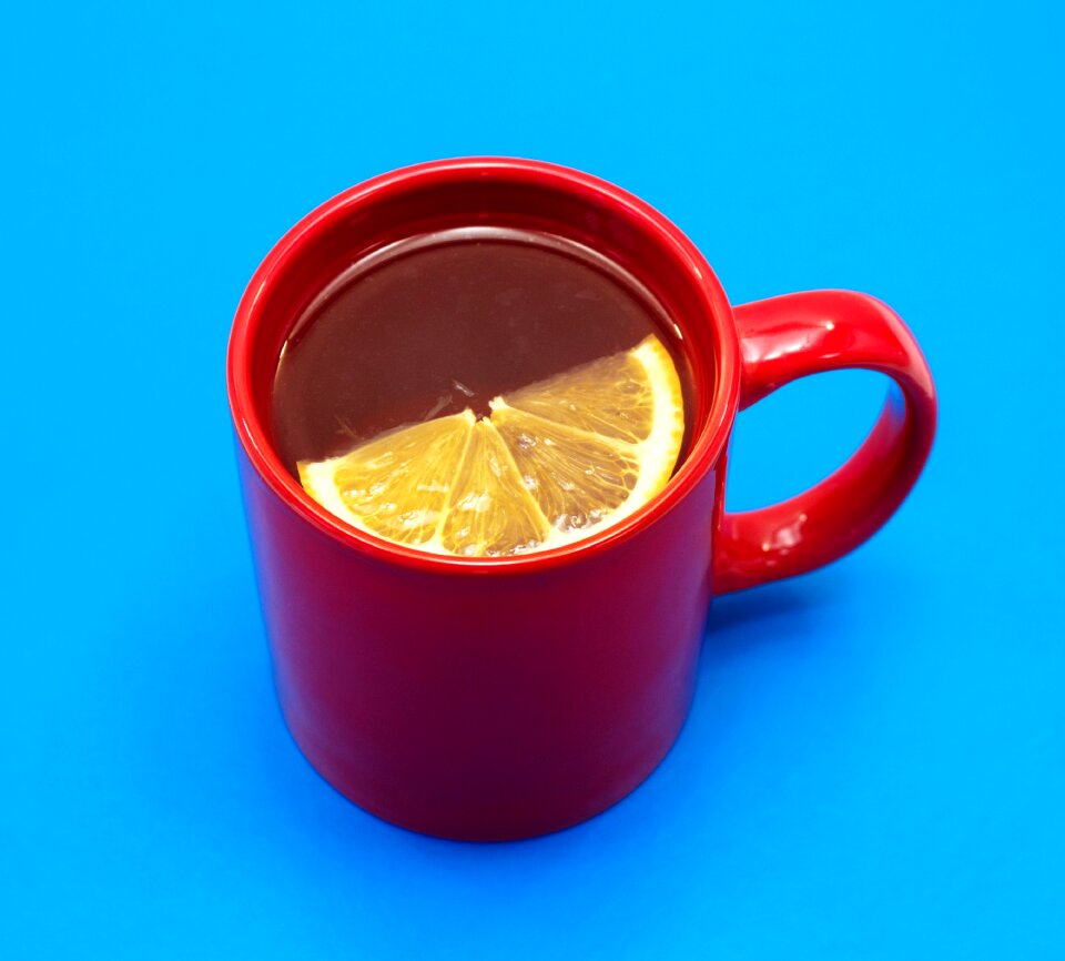 Lemon red mug blue background
