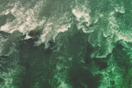 aerial view photography of ocean waves during daytime photo
