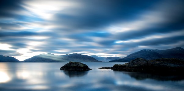 body of water near mountain