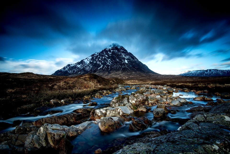 body of water at the foot of mountain
