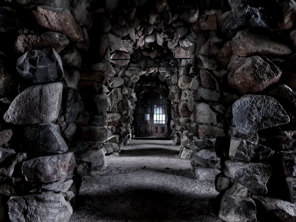 A walkway surrounded by stone pillars.