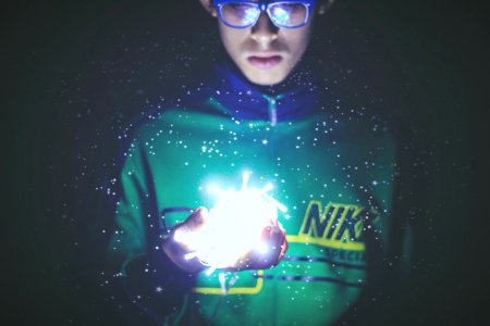 man holding turn-on white string light