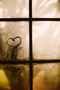 black framed glass window with heart draw photo
