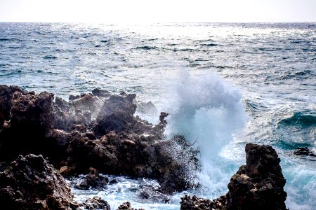 wave of sea on rocks photo