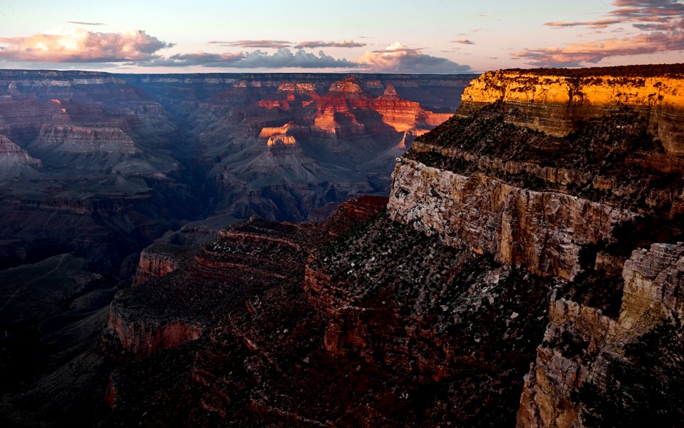 brown grand canyon under cloudy sky