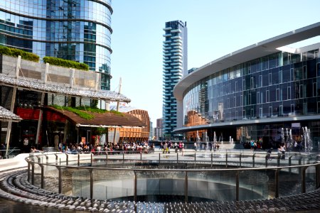 people gathering near building and round railings at daytime photo