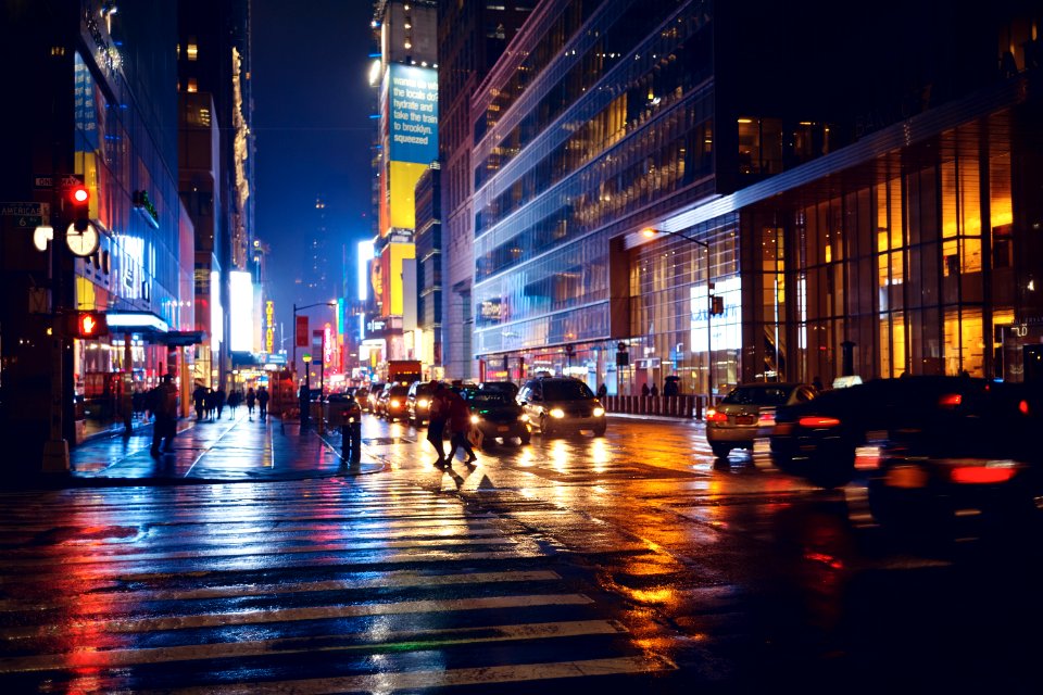 time-lapse photography of people and vehicles on road