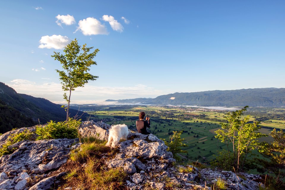 man sitting on the mountain cliff