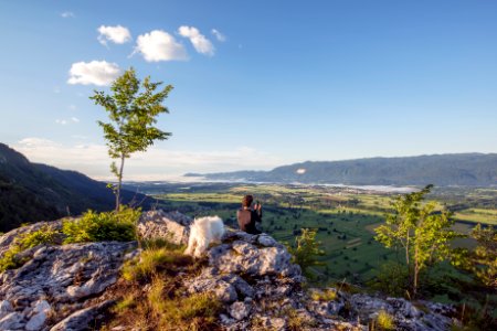 man sitting on the mountain cliff