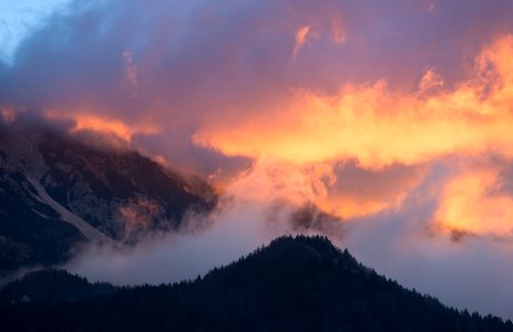 time-lapse photography of mountain under cloudy sky photo