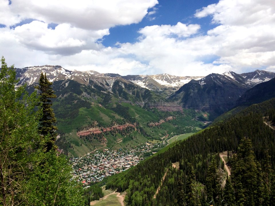aerial photograph of city between mountains