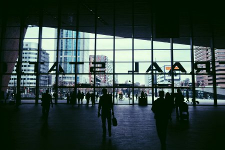 silhouette of people walking inside Raal Stat building photo