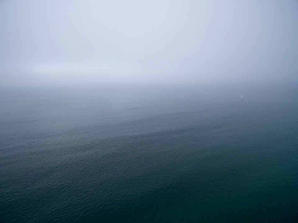 top view of ocean under grey clouds
