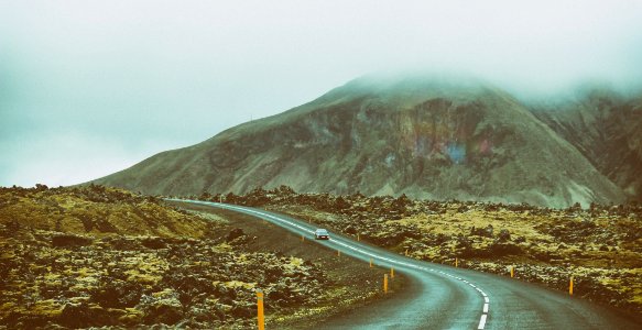 landscape photography of road between mountains photo