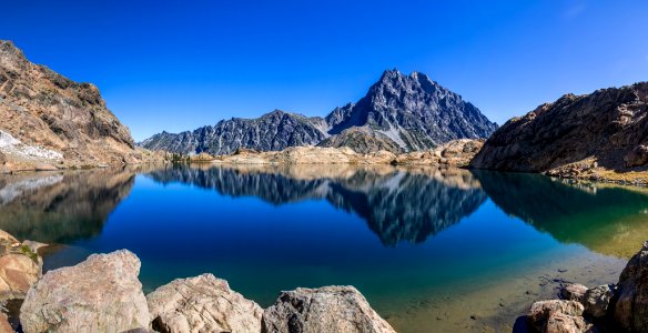 body of water in the middle of mountain photo