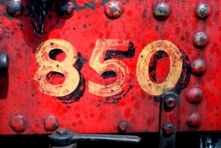 850-printed on red metal panel